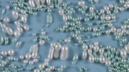 Pearls Falling on a Blue Surface