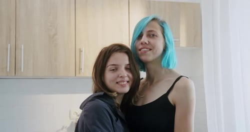 Loving Couple Embracing in Their Home Kitchen