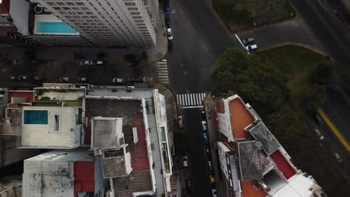 Crossroads in Buenos Aires, top view, cars pass the intersection and drive through the streets, beau