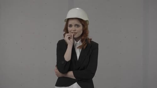 Frustrated Female Architect Nervous Worried Shrugs Her Shoulders and Spreads Her Arms Redhaired