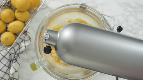 Stand Mixer Mixes Ingredients in Glass Bowl