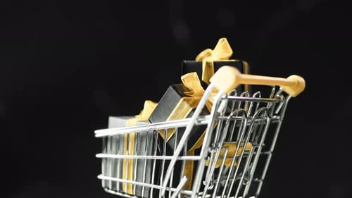 Miniature Shopping Cart Filled With Black Gift Boxes