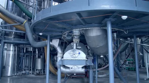 Modern food pipelines technology. Big steel construction of milk factory.