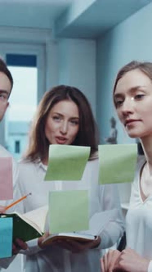 Engaging in Collaborative Brainstorming Sessions Within a Modern Office Environment