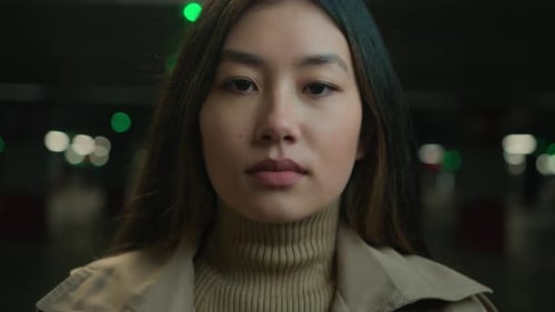 Close Up Portrait Pensive Serious Asian Chinese Ethnic Woman Young Girl Businesswoman Female in Dark