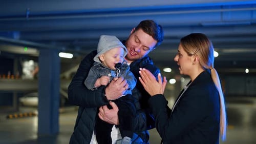 Family with Infant in an Underground Parking Garage