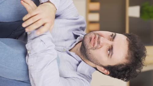 Vertical video of Stressed and worried man.