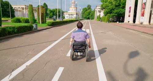 Road Disabled Person In A Wheelchair