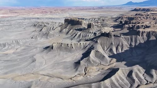 Aerial view of canyon formations and valley, USA.