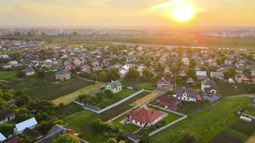 Aerial View of Residential Houses in Suburban Rural Area at Sunset