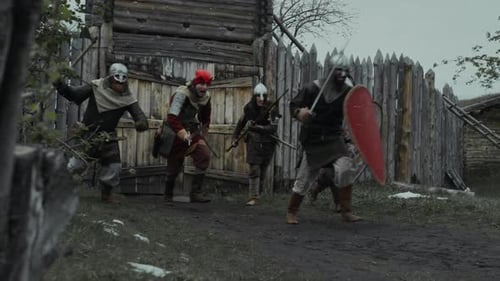 Group of Medieval Soldiers Charging into Battle from Fortress Gates