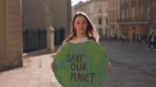 Woman Activist Standing on City Street and Holding Save Our Planet Ecology Poster