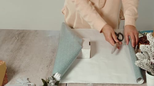 Woman Packing Christmas Gifts for Her Friends and Relatives