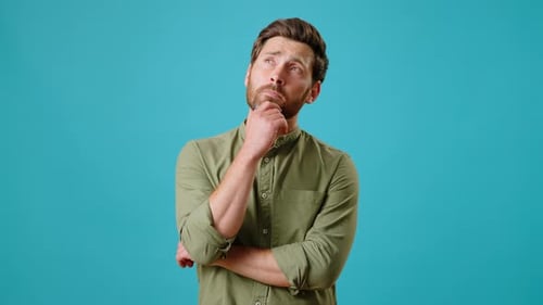 Man Thinking and Looking Confused on Blue Background
