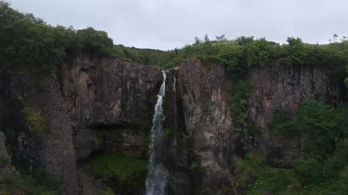 aerial shot of Powerful and beautiful waterfall in Iceland, wild green lush nature, nature documenta