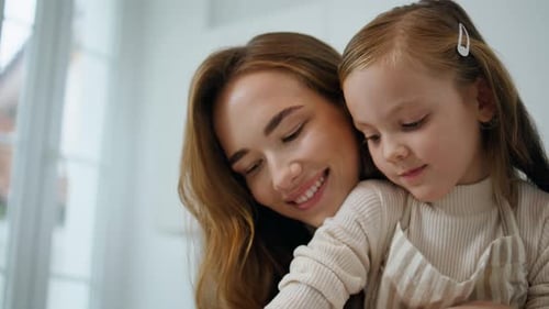 Happy Mother and Child Baking Together at Home