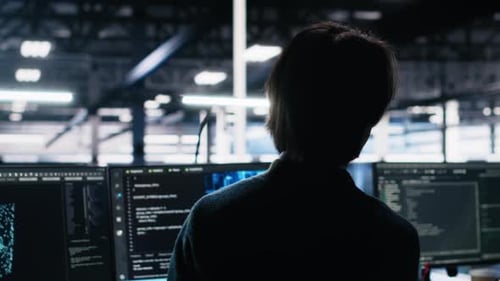 Data Center Software Developer Using Computer to Monitor Neural Network AI LLM