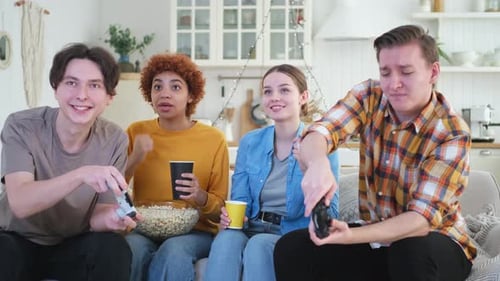 Home Party Cheerful Group of Friends Playing Video Games at Home Happy Diverse Group Buddies Having