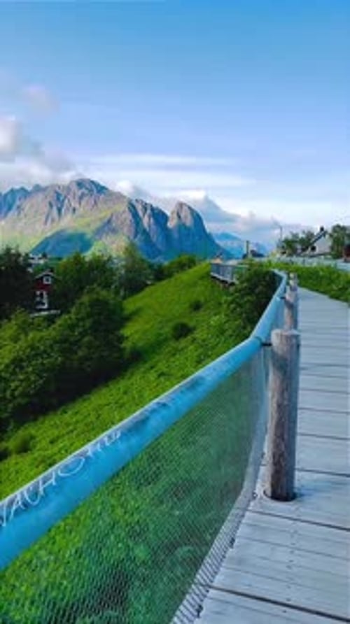 Picturesque Fishing Village and Mountain Reflections in Norwegian Fjord