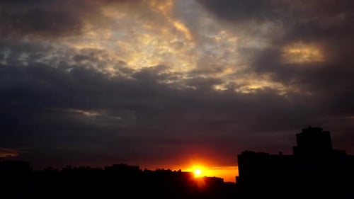 Fiery Sunset Time Lapse Over City Skyline