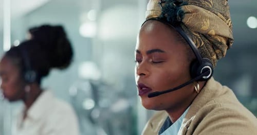 Woman Working in Office with Headset
