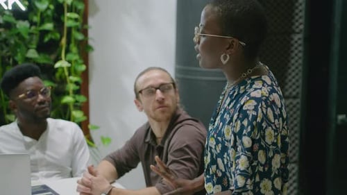 Team Discussing Business Strategy in Modern Office