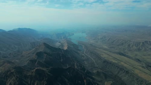 Majestic Mountains and Serene Lake from Above