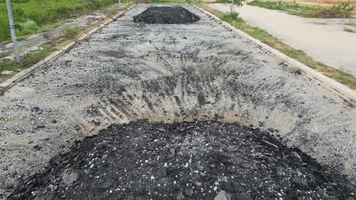 A large pile asphalt debris of dirt