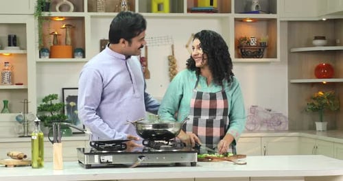 Couple Cooking Together in Bright Kitchen at Home