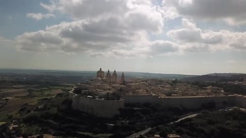 Aerial views of the medieval city of Mdina, Malta, Europe. City skyline with the Cathedral and city