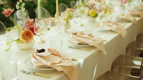 Elegant Table Setting with Floral Arrangements for Wedding