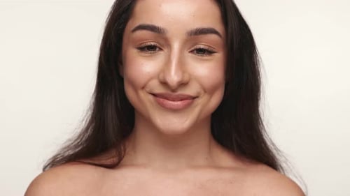 Smiling Woman's Face Close Up in Studio