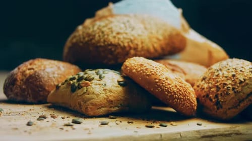 Fresh Baked Rustic Bread Assortment on Wooden Surface