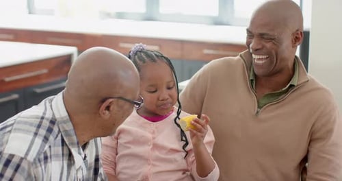 Family Enjoys Corn on the Cob at Home