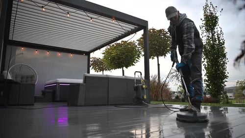 Pressure Washing a Patio Area at a Modern Outdoor Space