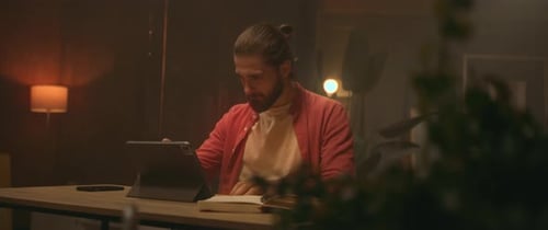 Footage of Handsome Thoughtful Young Caucasian Man Using Stylus While Drawing on Tablet Screen