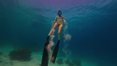 Woman Freediver Ascends in the Clean Tropical Sea