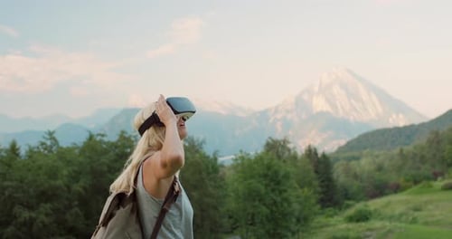 Woman in VR Headset in Mountains