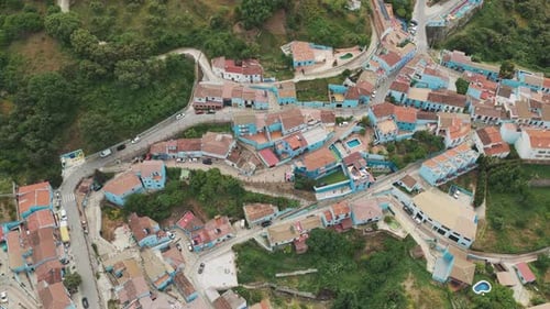 Aerial view of the blue houses of Juzcar, Spain.