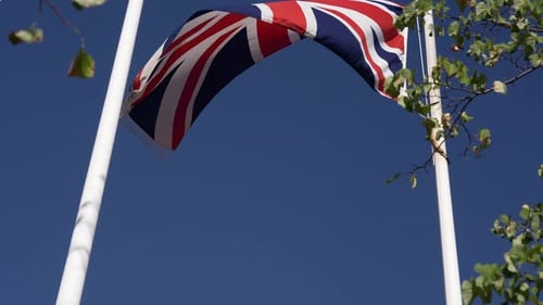 United Kingdom Flag Waving in a Blue Sky