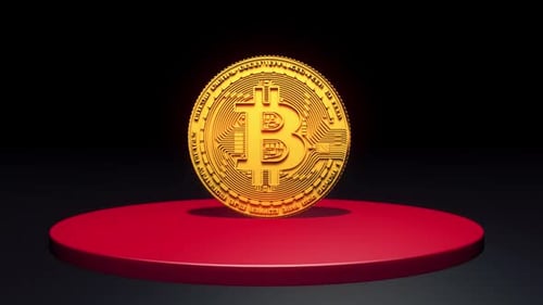 3D Bitcoin Rotating On A Red Podium
