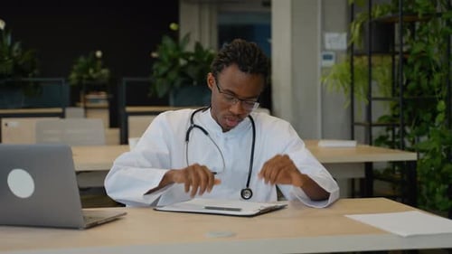 Doctor with Headache in Modern Office Environment