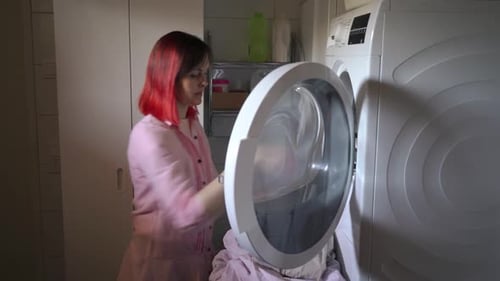 Woman Doing Laundry at Home