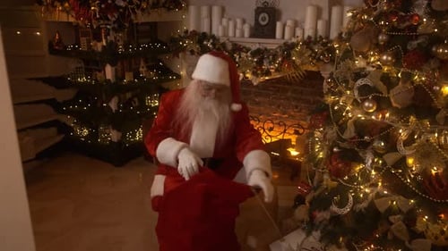 Santa Claus Delivering Presents by Christmas Tree