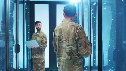 Two Men Working in Server Room With Technology