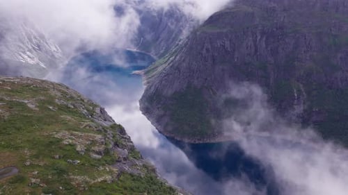 Beautiful nature Norway natural landscape Lovatnet lake flies above the clouds. fjords and mountains