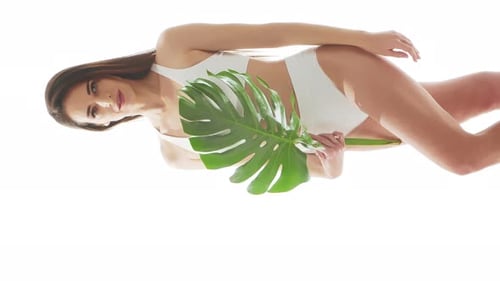 Beautiful Woman in White Underwear Over Isolated White Background Vertical Studio Video of Healthy