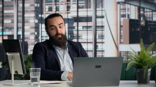 Bearded Man Talking During a Video Conference