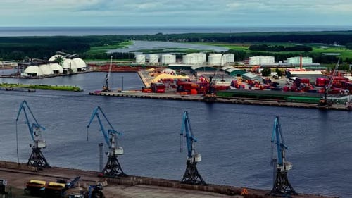 Panoramic View of the Industrial Port of Riga with Harbor Cranes and Terminals