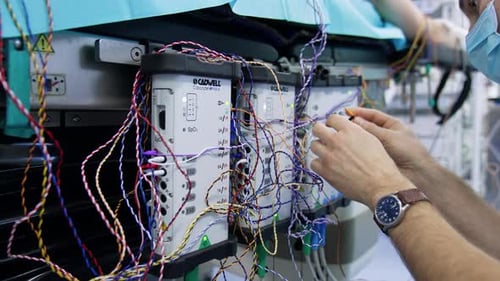 Medical Technicians Prepare Equipment in Hospital Room